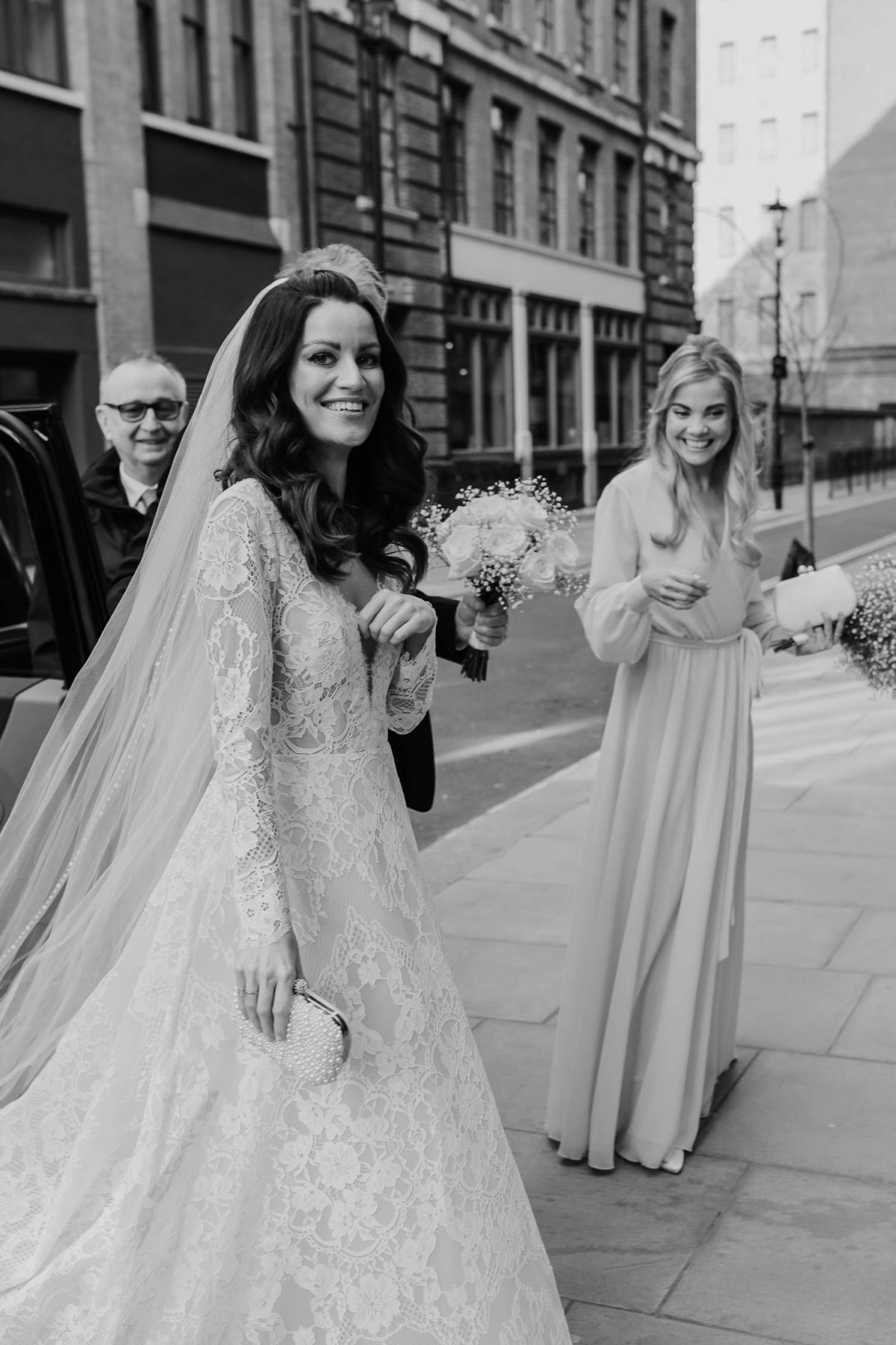 bride getting out of the car for fitzrovia chapel wedding