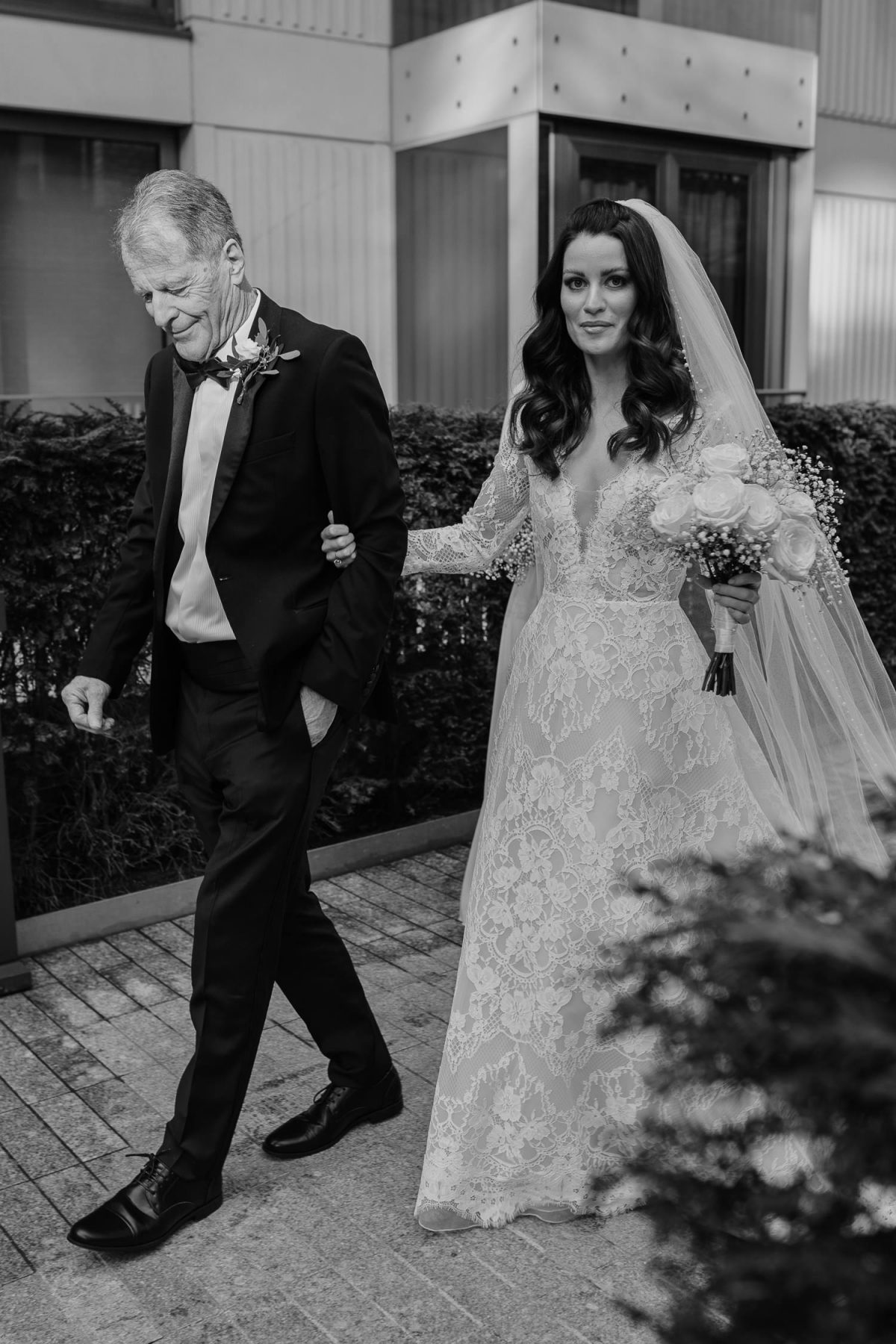 bride walking down with her dad to fitzrovia chapel wedding