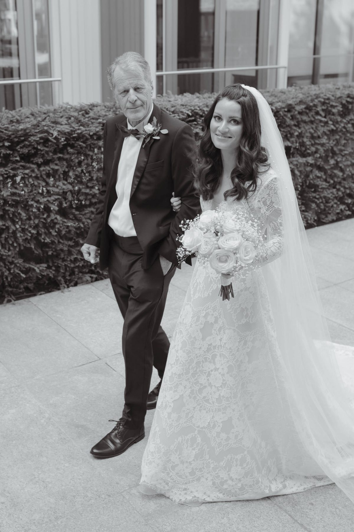 Bride and dad walking down to Fitzrovia chapel wedding