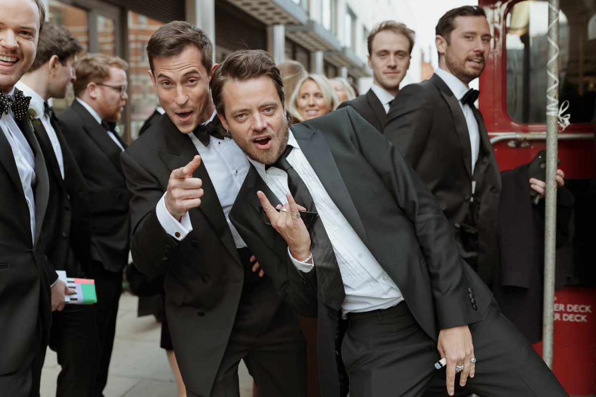 guests are getting on a bus to fitzrovia chapel wedding