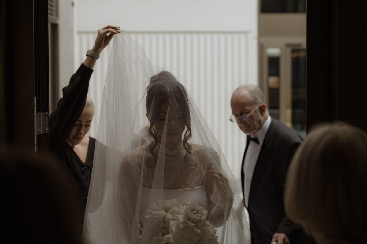 a bride with her veil on in Fitzrovia chapel wedding